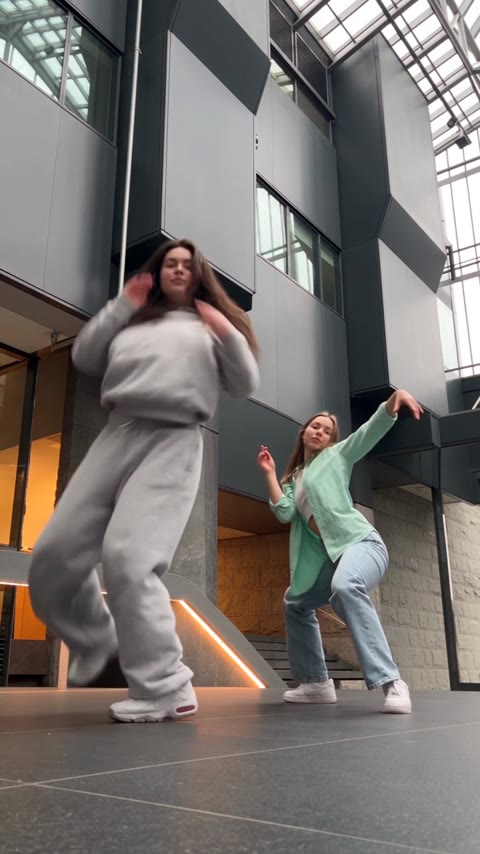 A2O LITE NEON Dance lead raising her hands while her partner leans backward