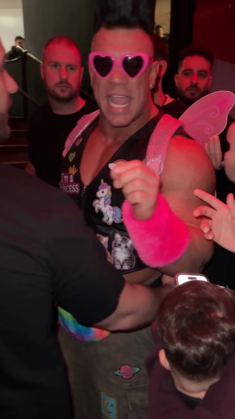 Bulin 47 AI Video opening with the pink-sunglasses performer gesturing in a crowded club