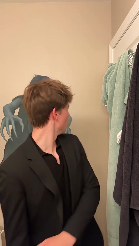 Ghost Filter Prank man turning to look over his shoulder as the hooded ghost remains visible