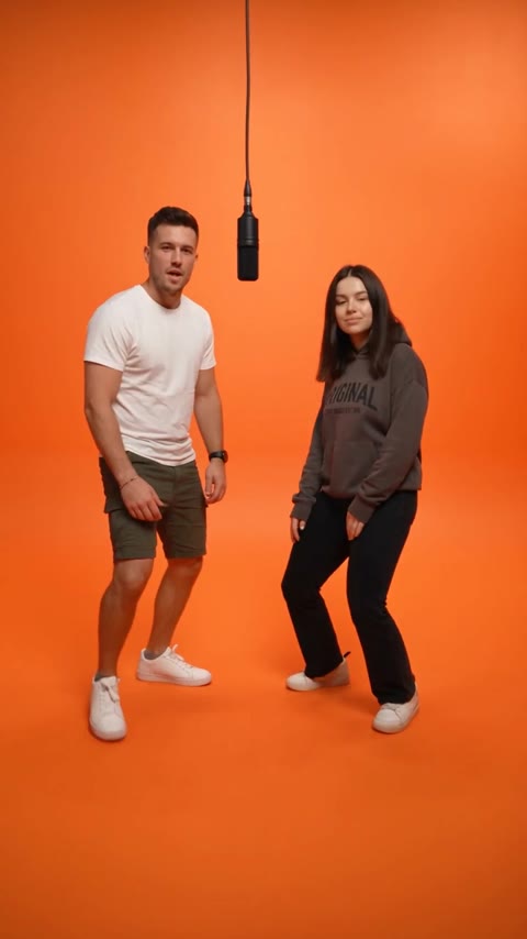 Hotel Lobby AI opening with both performers visible beneath the studio microphone