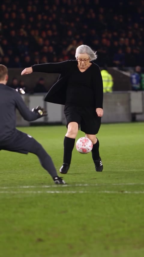 Ozil Goal AI player approaching the ball while an opponent slides across the grass
