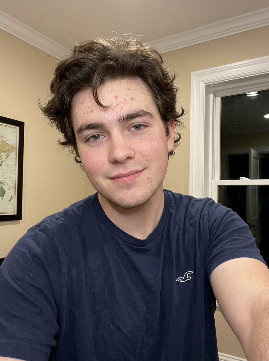 Man in a navy shirt taking an indoor selfie, second Boombox Rap AI input
